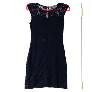 Black, sleek dress with lace-like overlay